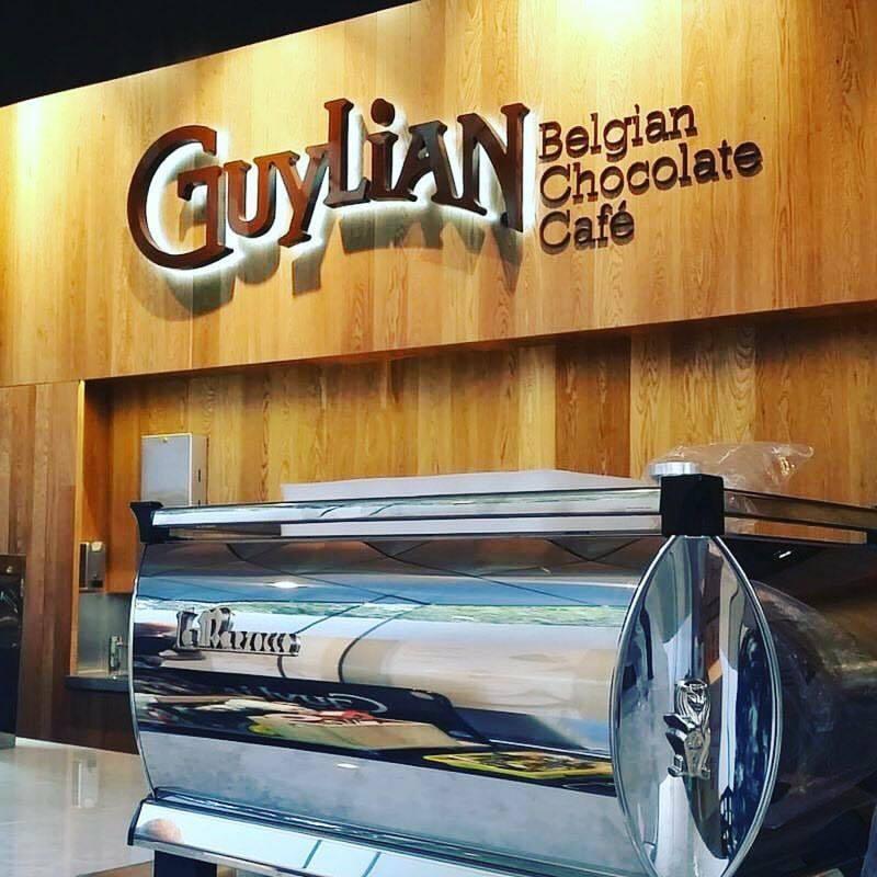 Illuminated fabricated letters for Guylian Belgian Chocolate Café on a timber wall