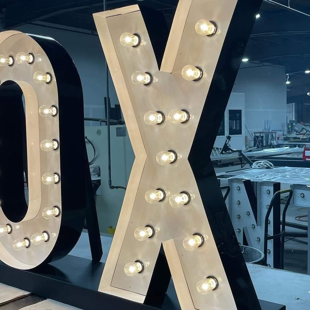 Marquee letters on welded steel bases in the workshop