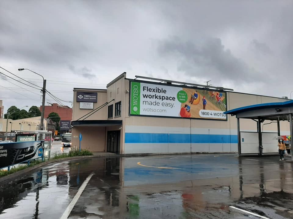 Large-format WOTSO banner installed on a building